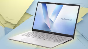 Slim silver ASUS Vivobook laptop open on a pastel yellow/blue abstract background.