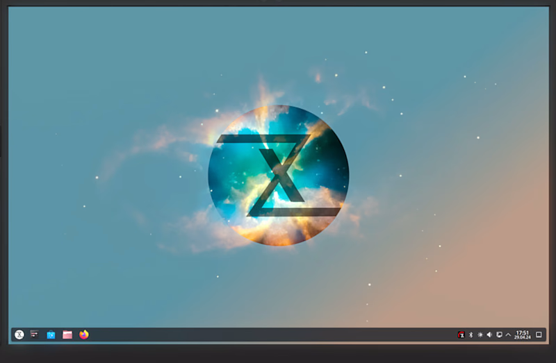 TUXEDO OS apre la open beta su Debian Testing Cosmic-themed desktop wallpaper with a glowing circular emblem containing an angular X at the center, on a blue-to-orange gradient background.